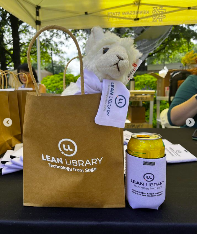 Stuffed llama toy in a paper bag