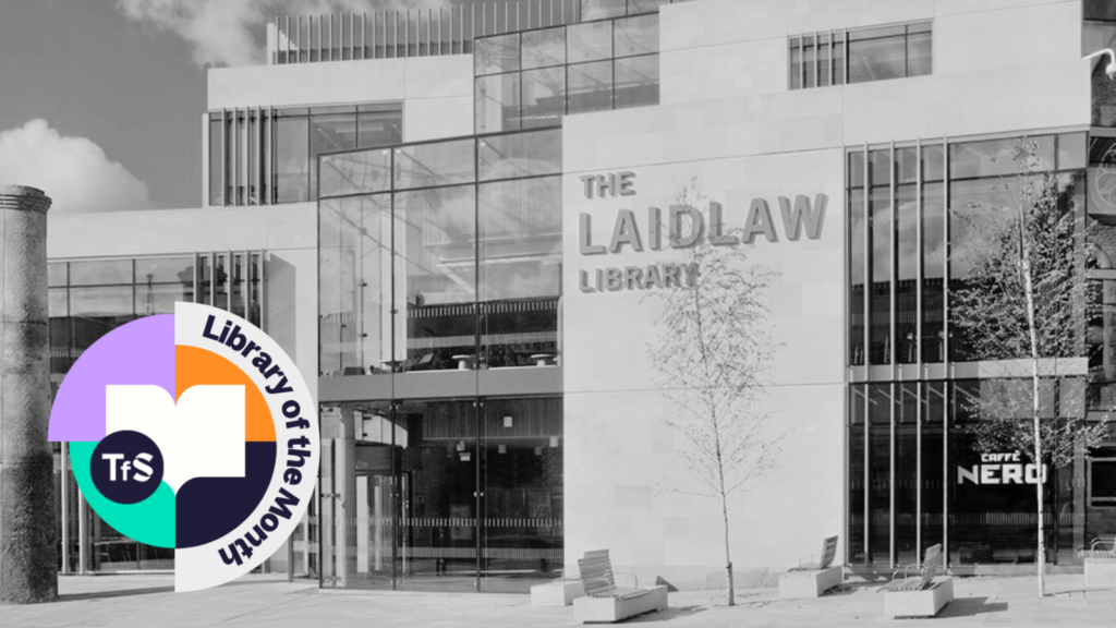 Black and white photo of inside of a library with Library of the Month logo